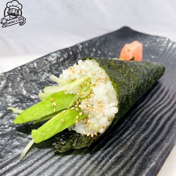 Relish our Avocado Cucumber Temaki, a refreshing asian vegetarian meal, featuring fresh avocado and cucumber in a hand roll.