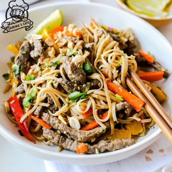 Savor our Beef Pad Thai, a delicious asian beef dish with stir-fried noodles, vegetables, and tender beef in a flavorful sauce.