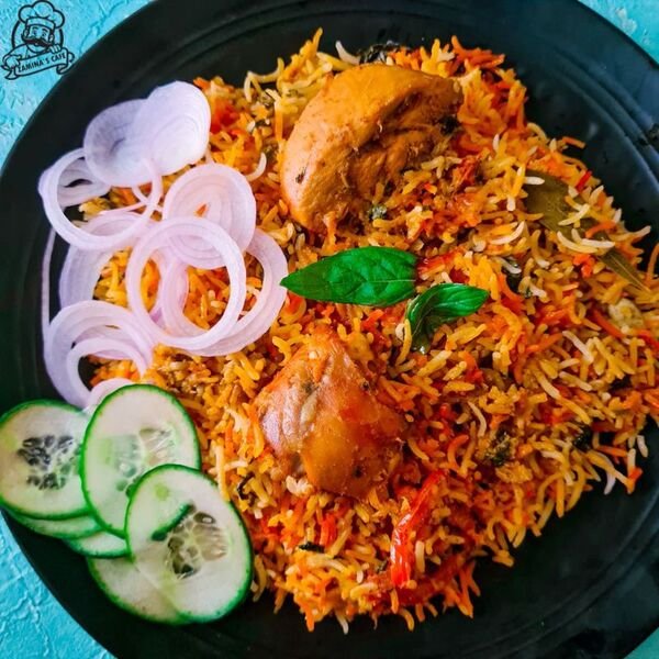 Savor our Chicken Biryani, a flavorful asian rice dish with spiced chicken, fragrant basmati rice, and aromatic herbs, perfect for a hearty meal.