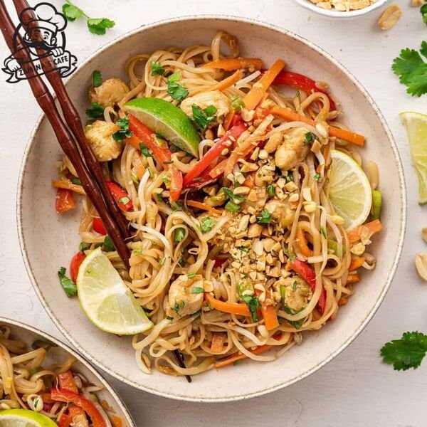 Enjoy our Chicken Pad Thai, a popular asian chicken dish with stir-fried noodles, vegetables, and tender chicken in a savory sauce.