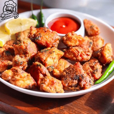 Indulge in our Chicken Pakora, a flavorful asian chicken dish featuring marinated chicken fried to crispy perfection.