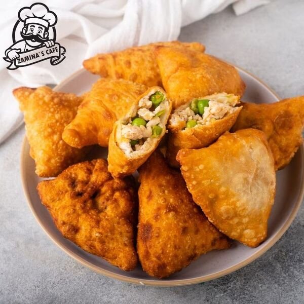 Savor our Chicken Samosa, a popular asian party food with a crispy exterior and flavorful spiced chicken filling.