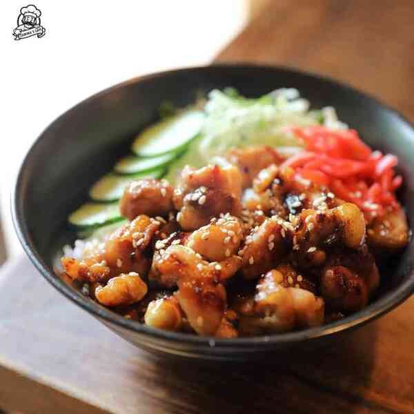 Try our Chicken Teriyaki Bun, a popular asian street food choice, featuring savory chicken teriyaki in a steamed bun.