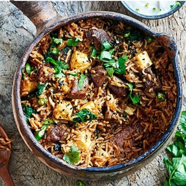 Relish our Lamb Biryani, a flavorful asian meat dish featuring tender lamb cooked with aromatic spices and rice for a hearty meal.