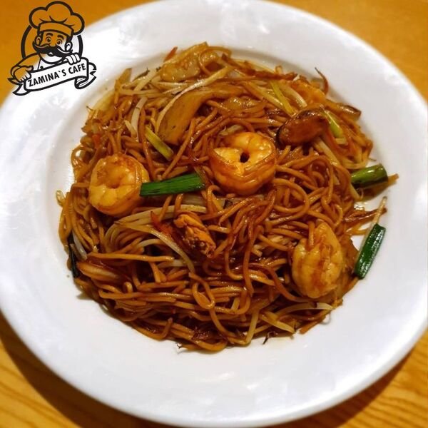 Enjoy our Mix Sea Food Chow Mein, a tasty chinese seafood dish with stir-fried noodles, vegetables, and a variety of seafood.