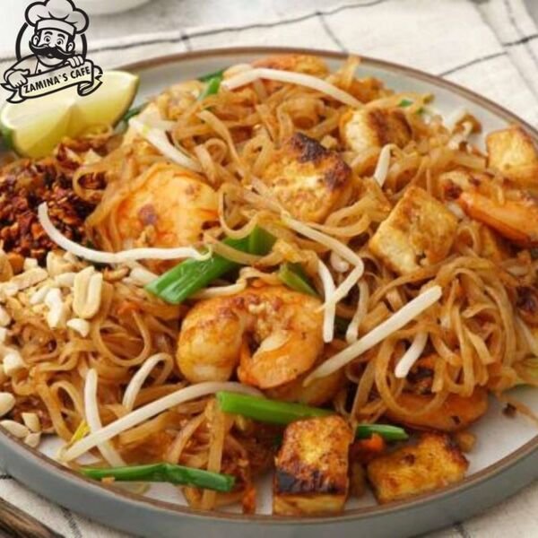 Relish our Prawn Pad Thai, a tasty asian seafood dish with stir-fried noodles, vegetables, and succulent prawns in a savory sauce.