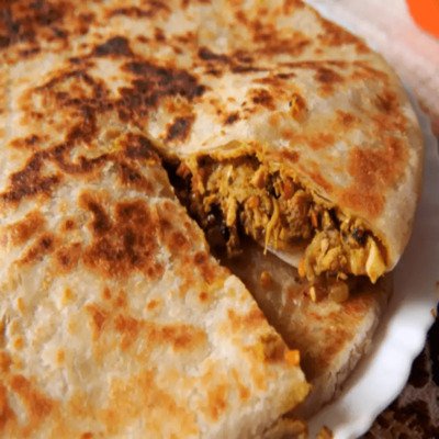 Savor our Qeema Paratha, a traditional asian food with spiced minced meat filling in a flaky, buttery bread. Order Online!