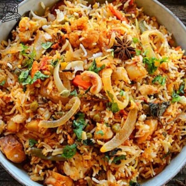 Enjoy our Veg Biryani, a tasty asian vegetarian meal featuring fresh vegetables cooked with aromatic spices and rice.