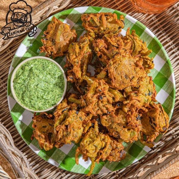 Try our Veg Pakora, a tasty asian vegetarian meal made with mixed vegetables fried in a savory chickpea batter. Order Online!